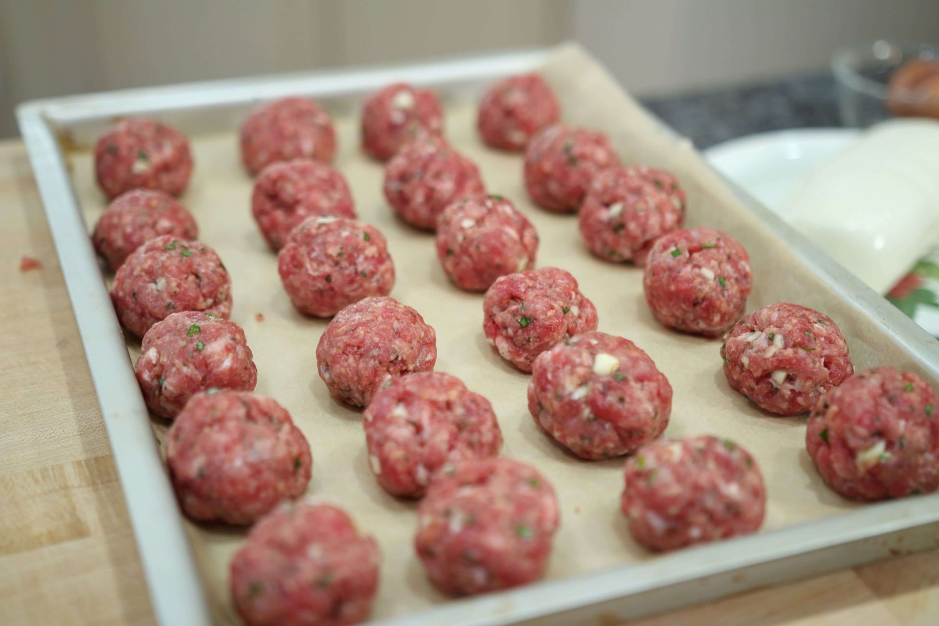 two meatballs in a kitchen menu        
        <figure class=